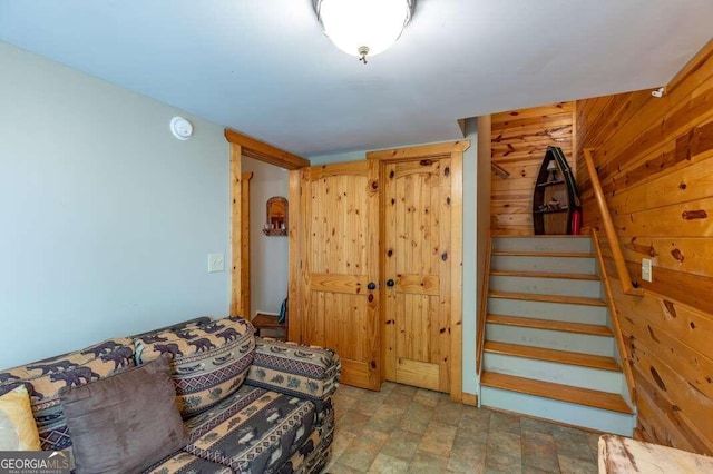 living room with wooden walls