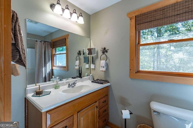 bathroom with vanity and toilet