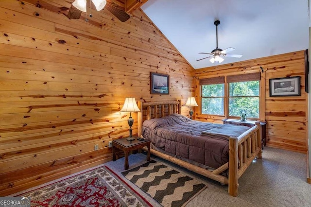 bedroom featuring wood walls, carpet floors, high vaulted ceiling, and ceiling fan