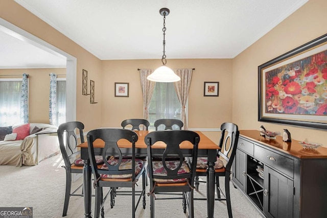 dining area with light colored carpet