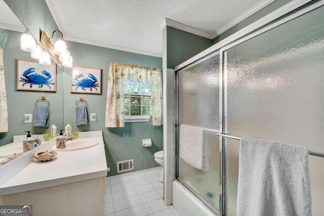 full bathroom featuring a textured ceiling, toilet, ornamental molding, vanity, and tile patterned floors