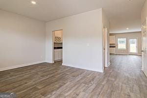 319 Brooks Dr Unit 73, Fairburn, GA 30213 - unfurnished room featuring wood finished floors, baseboards, and recessed lighting