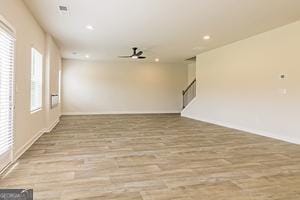 319 Brooks Dr Unit 73, Fairburn, GA 30213 - unfurnished room with recessed lighting, wood finished floors, a ceiling fan, baseboards, and stairway