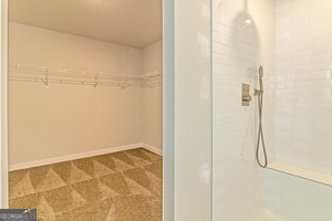 interior space featuring a tile shower