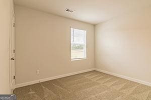 319 Brooks Dr Unit 73, Fairburn, GA 30213 - empty room featuring carpet flooring and baseboards