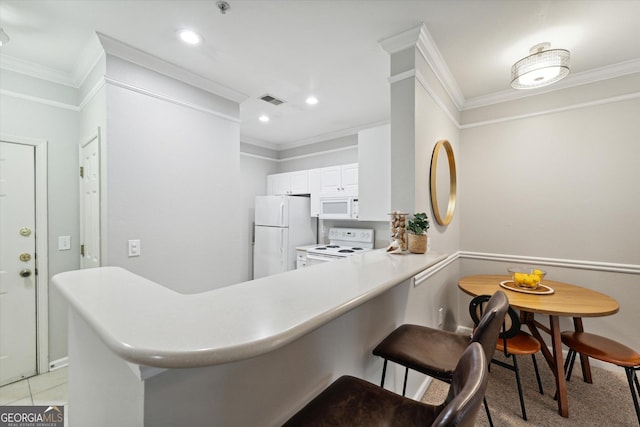 1517 Whitemarsh Way, Savannah, GA 31410 - kitchen featuring white appliances, crown molding, a peninsula, light countertops, and recessed lighting