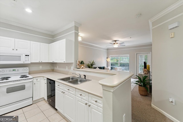 1517 Whitemarsh Way, Savannah, GA 31410 - kitchen featuring white appliances, a sink, crown molding, a peninsula, and white cabinetry