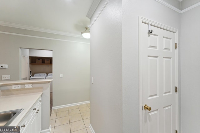 1517 Whitemarsh Way, Savannah, GA 31410 - laundry area featuring separate washer and dryer, crown molding, light tile patterned floors, and baseboards