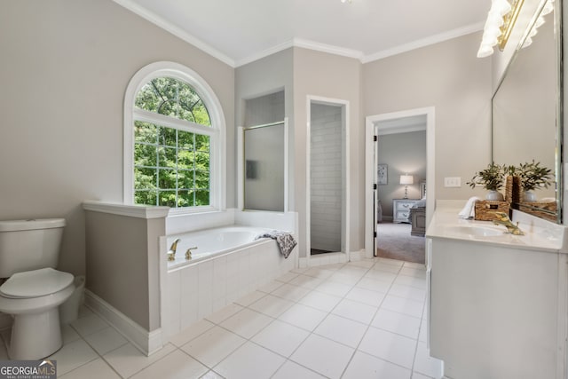 full bathroom featuring independent shower and bath, toilet, vanity, crown molding, and tile patterned floors