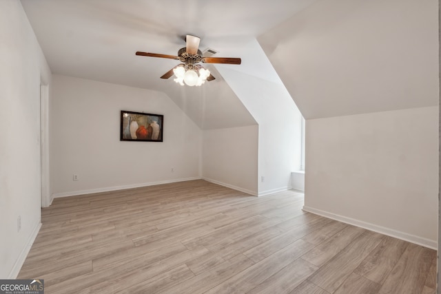 bonus room featuring vaulted ceiling, light wood-type flooring, and ceiling fan