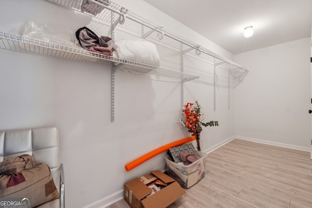 spacious closet featuring hardwood / wood-style flooring