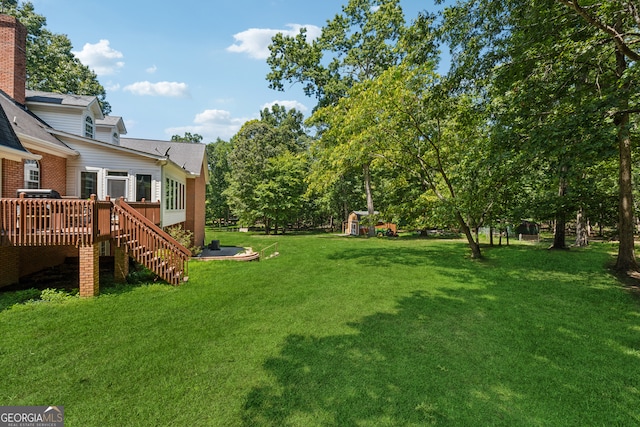 view of yard with a deck