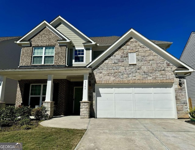 craftsman-style house featuring covered porch and a garage