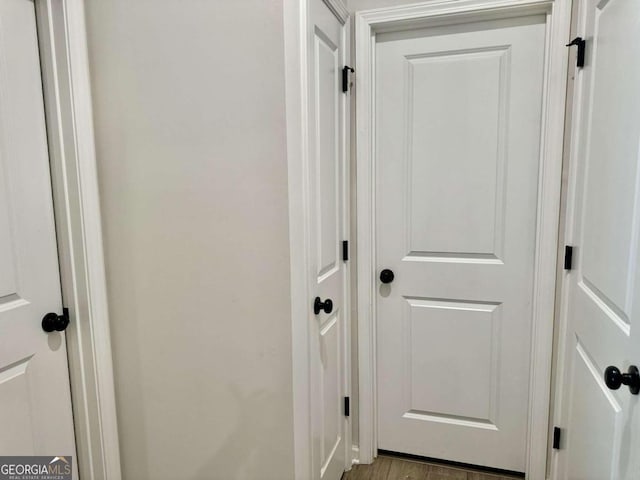 corridor with light wood-type flooring