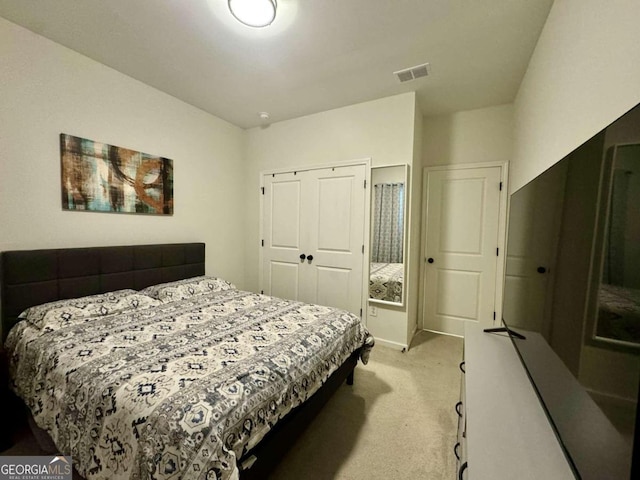 carpeted bedroom featuring a closet