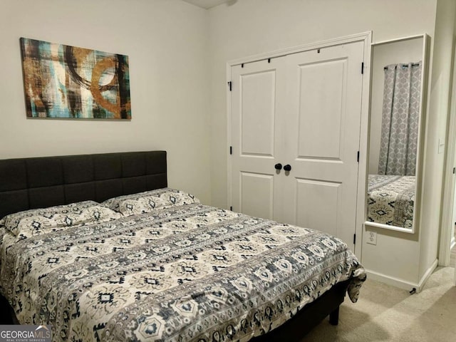 carpeted bedroom with a closet