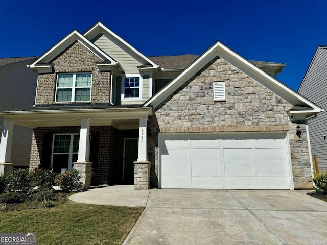 craftsman inspired home with covered porch and a garage