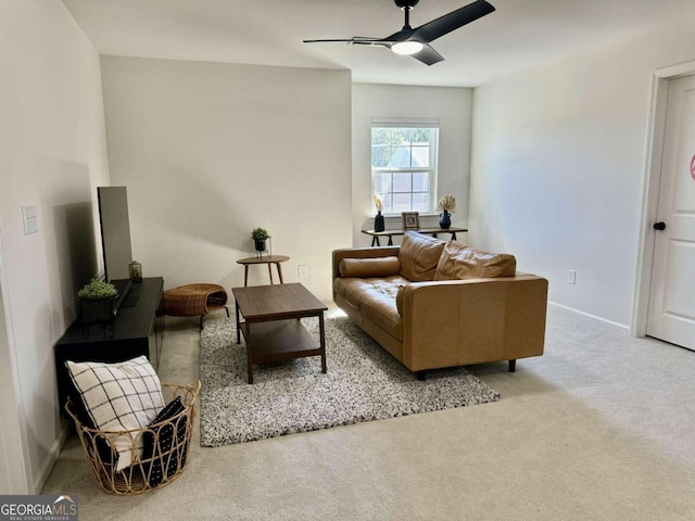 living area with ceiling fan and light colored carpet