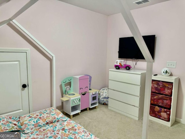 bedroom featuring light colored carpet