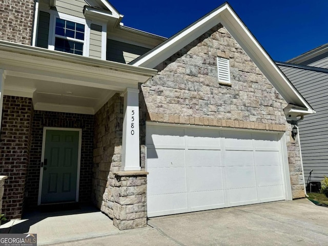 entrance to property featuring a garage