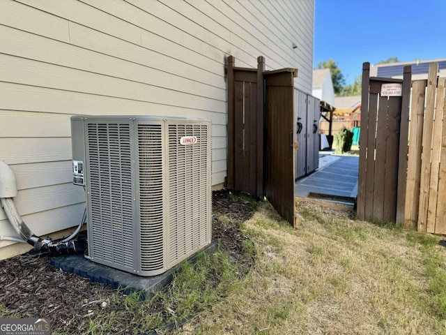 exterior details featuring wooden walls and cooling unit