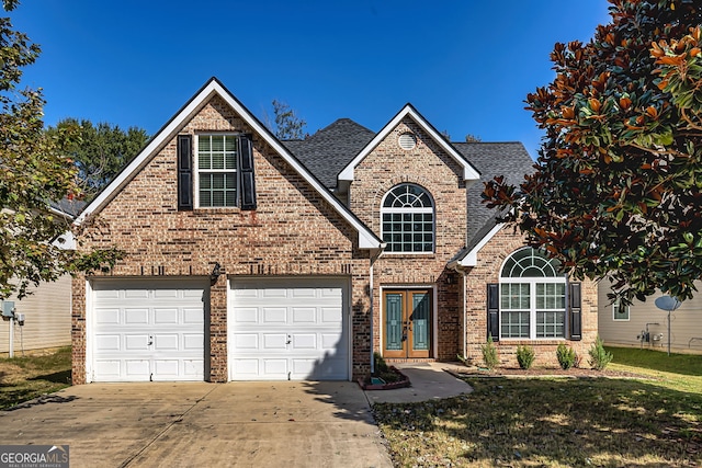 view of front of home featuring a garage and a front lawn