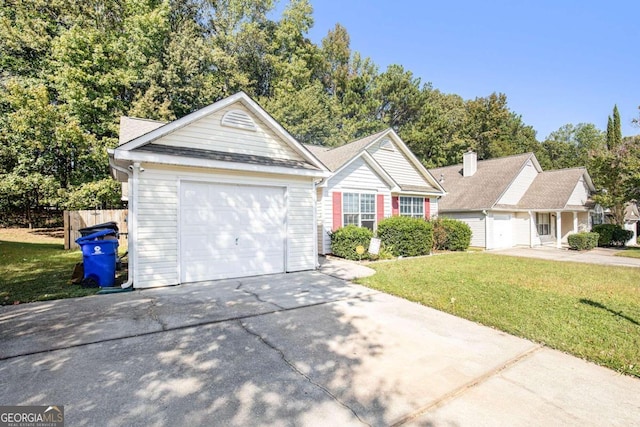 view of front of home featuring a garage and a front yard