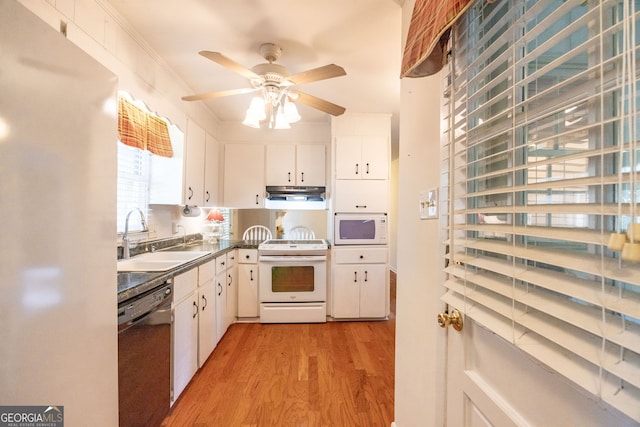 kitchen with light hardwood / wood-style floors, sink, crown molding, white cabinets, and white appliances