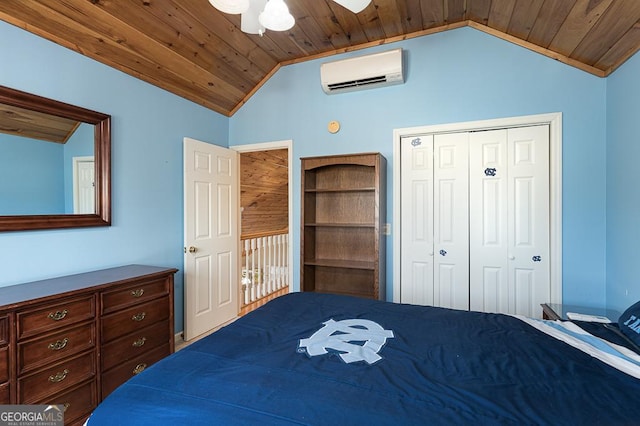 bedroom with lofted ceiling, a closet, a wall unit AC, and wood ceiling