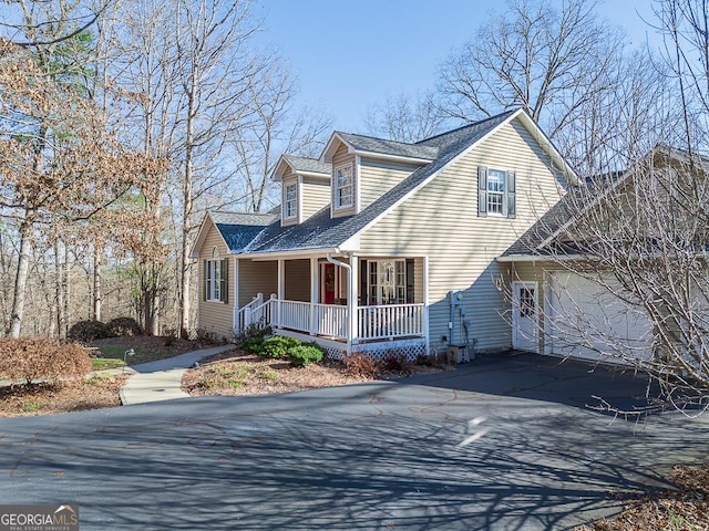 exterior space featuring a porch and a garage