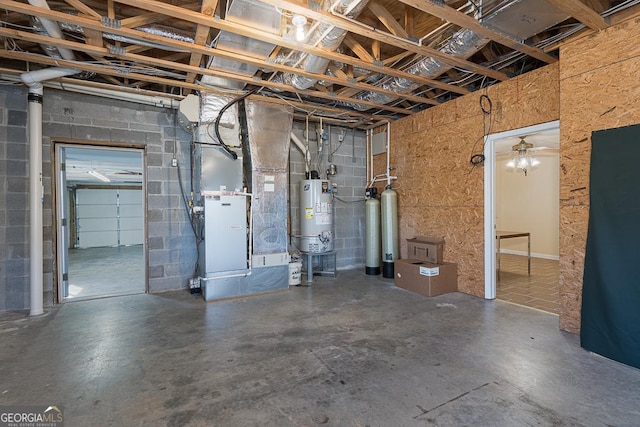 basement featuring water heater and heating unit