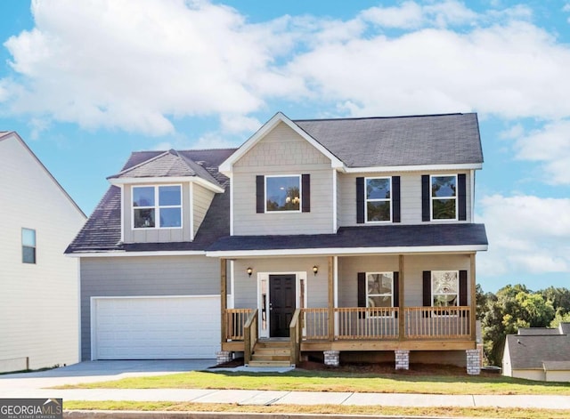 view of front facade featuring a porch and a garage