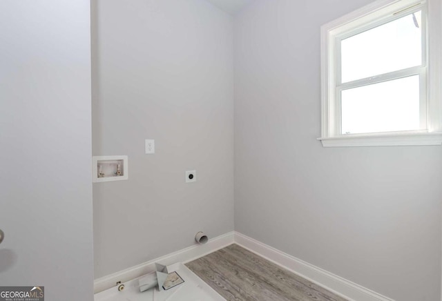 washroom featuring washer hookup, hookup for an electric dryer, and hardwood / wood-style floors