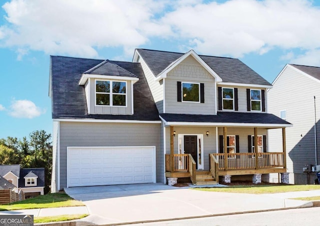 view of front of home with a porch and a garage