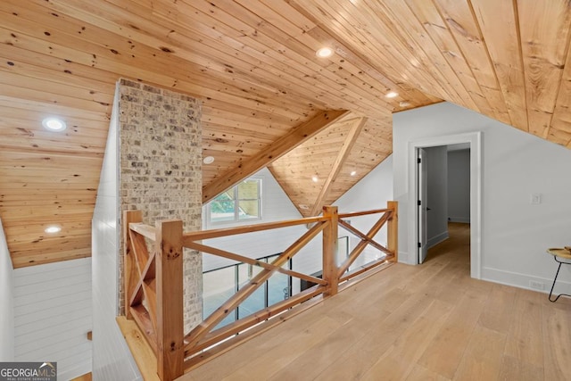 bonus room with wood ceiling, vaulted ceiling, and light hardwood / wood-style flooring