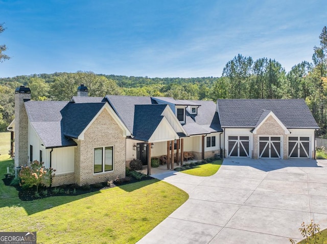 modern farmhouse with a garage and a front yard