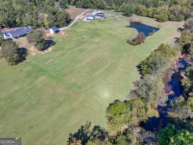 aerial view with a water view and a rural view