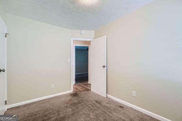 4660 Edwina Ln SW, Atlanta, GA 30331 - carpeted empty room featuring baseboards and a textured ceiling