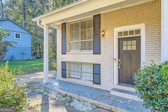 4660 Edwina Ln SW, Atlanta, GA 30331 - doorway to property featuring brick siding and covered porch