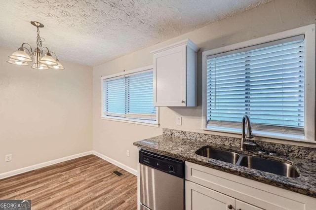 kitchen with dishwasher, light hardwood / wood-style flooring, sink, a chandelier, and white cabinetry