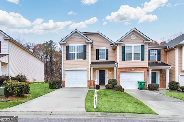 view of front of house featuring a front lawn and a garage