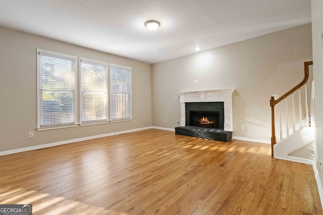 unfurnished living room featuring light hardwood / wood-style floors