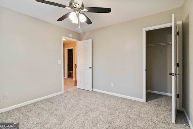 unfurnished bedroom featuring light carpet, a closet, and ceiling fan