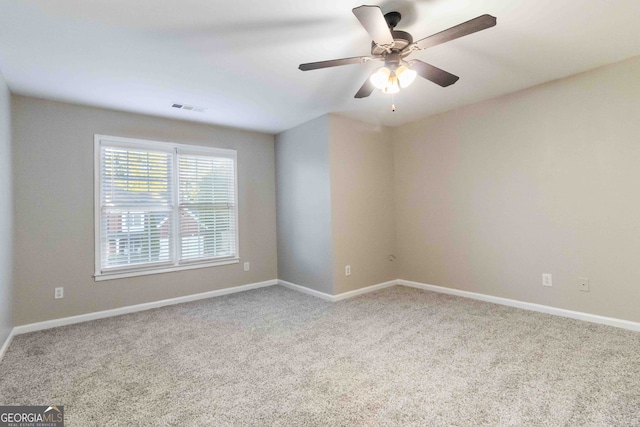 empty room featuring light carpet and ceiling fan