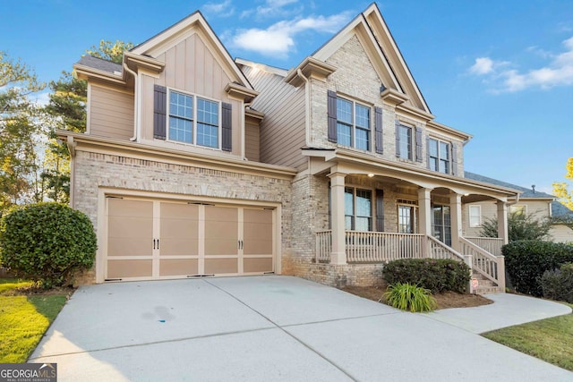 view of front of home featuring a porch and a garage