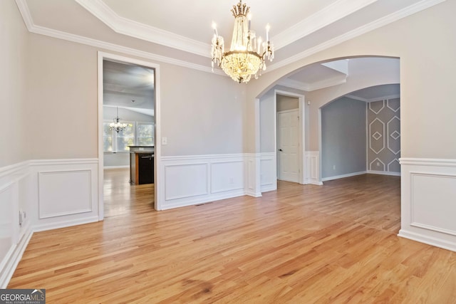 unfurnished dining area featuring ornamental molding and light wood-type flooring