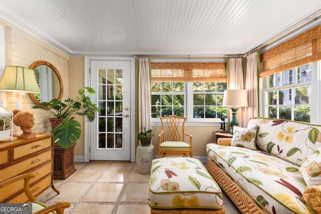 sunroom / solarium featuring wood ceiling