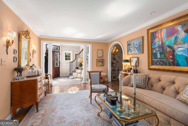 living room featuring ornamental molding and light wood-type flooring