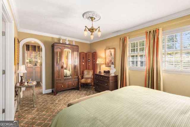 carpeted bedroom with an inviting chandelier and crown molding