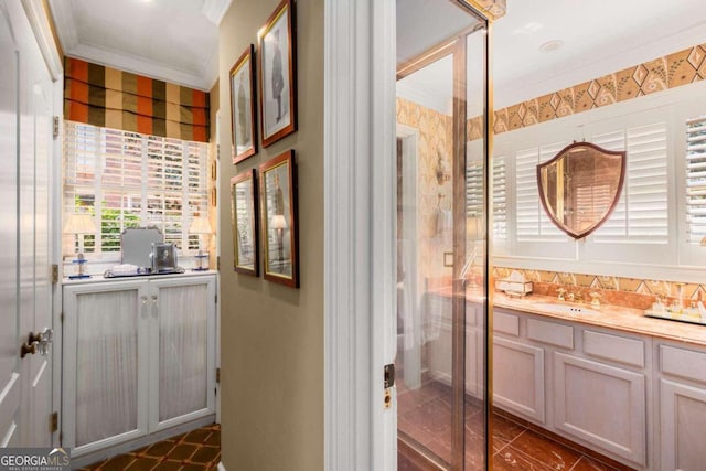 bathroom with vanity and crown molding